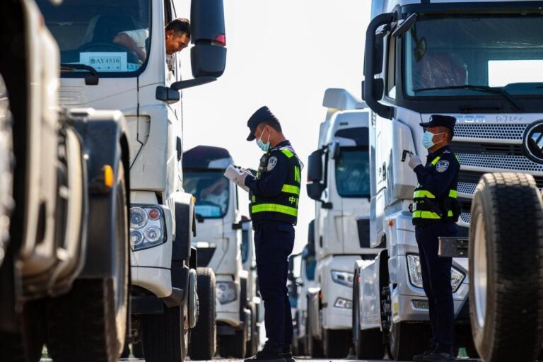 Trucks and freight trains at keupjras Xinjiang border port driving cross-border trade