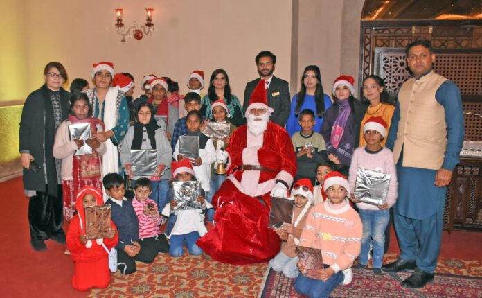 Children from charity schools attending a hi-tea event at Islamabad Serena Hotel
