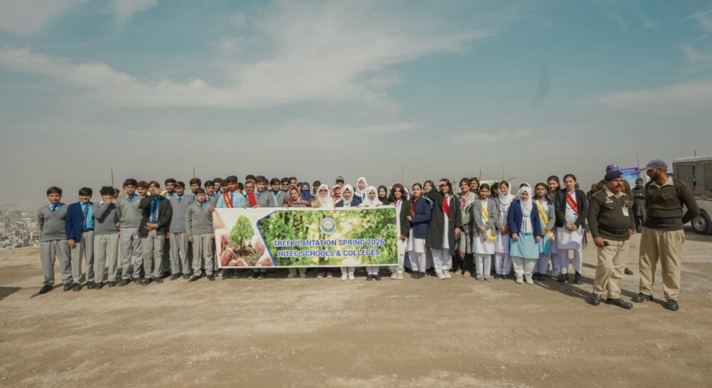 Participants plant saplings during the Margalla Hills plantation campaign launched in Islamabad.