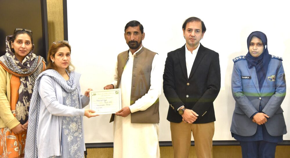 Participants attend transport safety workshop at Fatima Jinnah Women University in Rawalpindi.