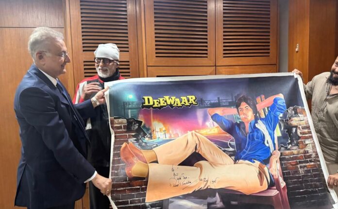 Amitabh Bachchan with signed Deewaar canvas