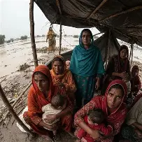 Women and children receiving support under the climate resilience project in flood-affected districts of Pakistan.