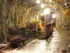 Workers and researchers involved in the Gilgit-Baltistan minerals project examining mineral samples and processing equipment.
