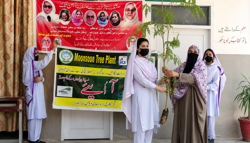 Students participate in a monsoon plantation awareness event at a girls school in Mansehra.