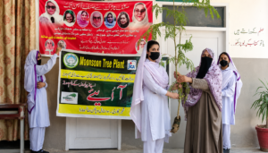 Students participate in a monsoon plantation awareness event at a girls school in Mansehra.
